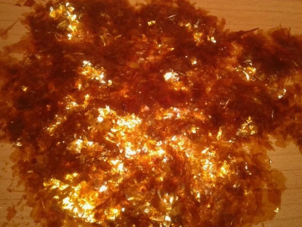 Goma en escamas Paquete de 1 kg